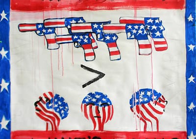 Banner protesting proportion of guns per capita in USA