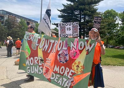 2022 Jun March for Our Lives Portland banner for gun control held by marchers