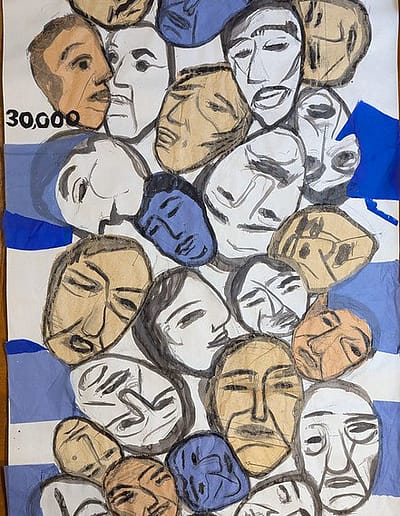 The death toll of Gaza is illustrated with an array of faces on a poster.